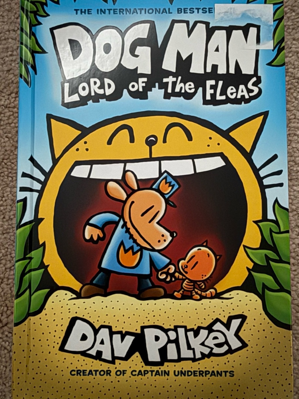 Scholastic Dog Man Cover — Bright Blue & Yellow Illustration